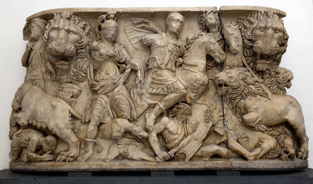 Anceint Roman sarcophagus carved in the ancient Greek style depicting a lion hunt.