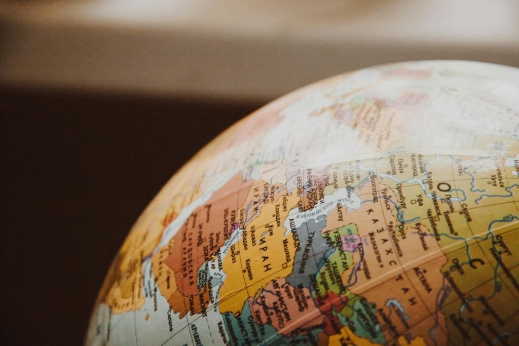 A close-up view of a globe showing parts of Europe, the Middle East, and Africa, highlighting country borders and names.