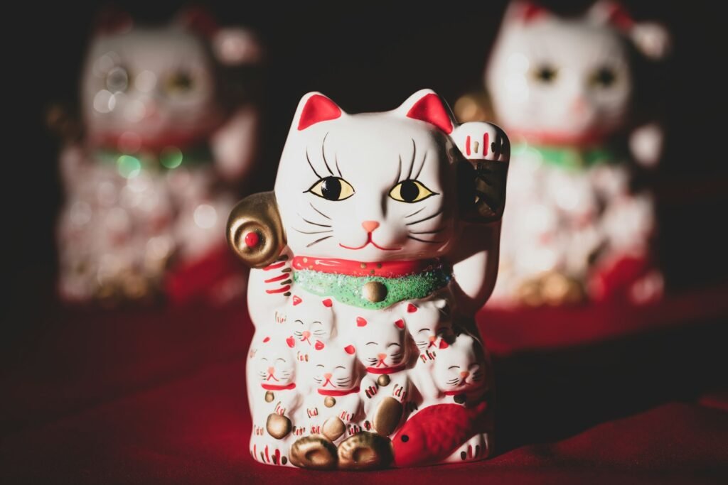 Cat Superstiton white and red ceramic cat figurine
