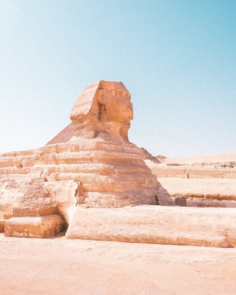 Capture of the iconic Great Sphinx of Giza under a clear blue sky in Egypt.