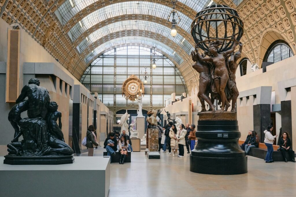 A group of people walking around a museum