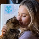 Stray Cat Penny's Grateful Embrace with Rescuer Captivates Millions Online